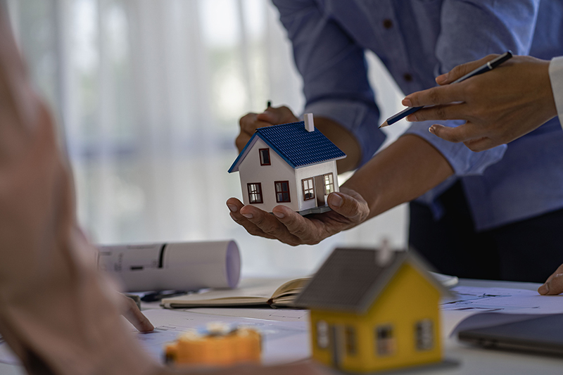 westerleigh staten island  home agent holding a miniature house